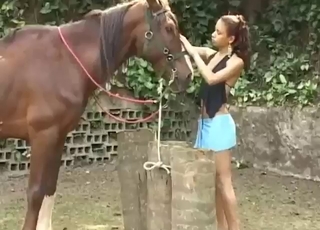 Her vaginal muscles tense as she sucks a horse